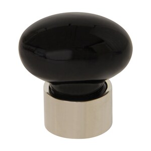 May include: Black ceramic knob with a silver base. The knob is round and has a smooth, glossy finish.