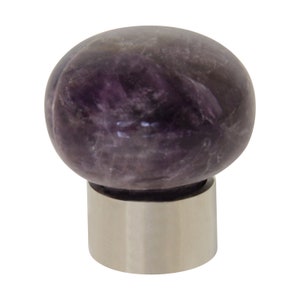 May include: A round amethyst gemstone knob with a silver base. The knob is a deep purple color and has a smooth, polished finish.