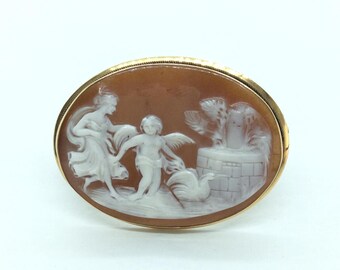 Vintage 18k Leda and the swan and Cupid cameo brooch yellow gold complete bezel set.