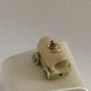 Chuck Wagon Charm in Bone with button wheels Golf Filled Findings