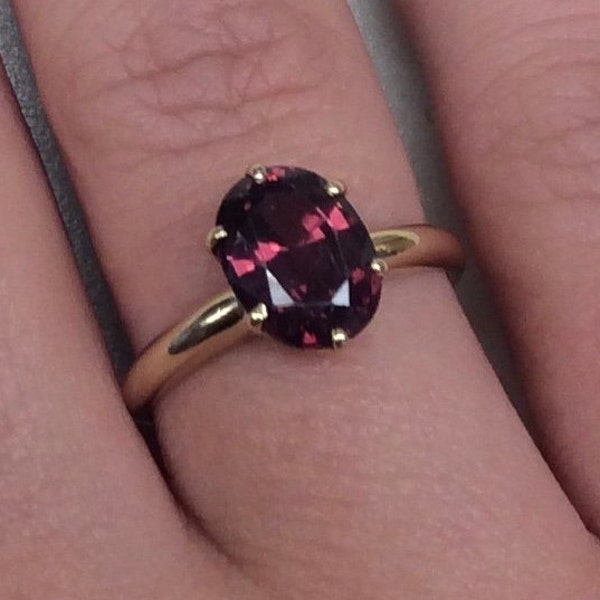 14k Garnet ring,in six Prong Solitaire setting with a  Oval Grape Garnet so,pretty