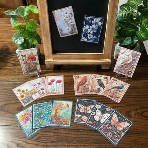 May include: A collection of 12 vintage-style cards featuring various floral and bird illustrations. The cards are printed on thick paper and have a matte finish. They are perfect for scrapbooking, card making, or adding a touch of vintage charm to any project.