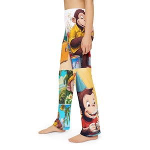 May include: Full-length leggings featuring a vibrant, multi-panel graphic print of a cartoon monkey. The design includes scenes of the monkey wearing a yellow shirt with paint cans, wearing a blue party hat with food, and standing near palm trees.