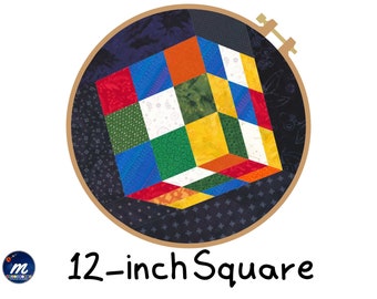 May include: A 12-inch square embroidery hoop with a colorful patchwork cube design. The cube is made of different colored fabrics, including red, yellow, green, blue, and white.