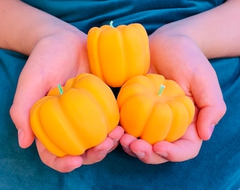 Set of three pumpkin candles