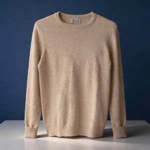 May include: A set of three ceramic mugs with a speckled, matte finish. The mugs are in shades of cream, light gray, and dark gray. Each mug has a simple, minimalist design, perfect for coffee or tea.