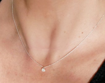 Women's small solitary heart pendant in minimalist recycled 925 silver for women and children on a fine adjustable chain