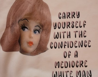Carry yourself with the confidence of a mediocre white man tee tshirt, doll head logo tee, patriarchy, gals gal, stand up