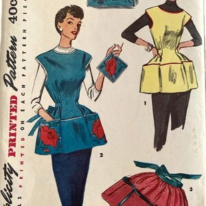 May include: Simplicity printed pattern 4492 for a small size apron. The envelope features illustrations of three apron styles: a teal apron with red floral pockets, a yellow apron with pockets, and a red gathered apron with a dark green tie.