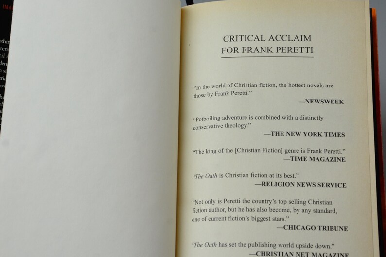 May include: Open book pages with text: "CRITICAL ACCLAIM FOR FRANK PERETTI." Quotes from Newsweek, The New York Times, Time Magazine, Religion News Service, Chicago Tribune, and Christian Net Magazine praising Frank Peretti's work.