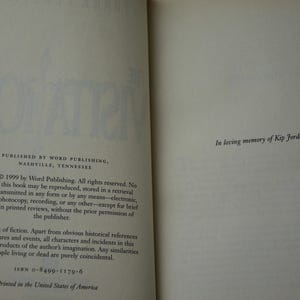 May include: Open book pages with text. The left page states the publisher, copyright information, and ISBN. The right page reads "In loving memory of Kip Jordon."