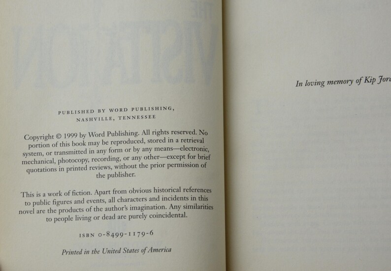 May include: Open book pages with text from a 1999 publication by Word Publishing, Nashville, Tennessee. The text includes copyright information, a statement about the work being fiction, and the ISBN. The right page has the text "In loving memory of Kip Fore."