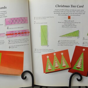 May include: A craft book with instructions on how to make parallel-cut notecards and a Christmas tree card. The book includes illustrations and step-by-step instructions for each project.
