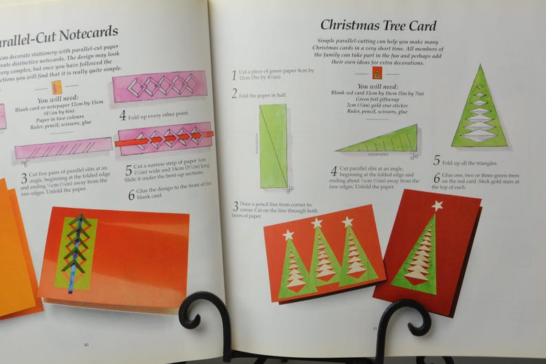 May include: A craft book with instructions on how to make parallel-cut notecards and a Christmas tree card. The book includes illustrations and step-by-step instructions for each project.