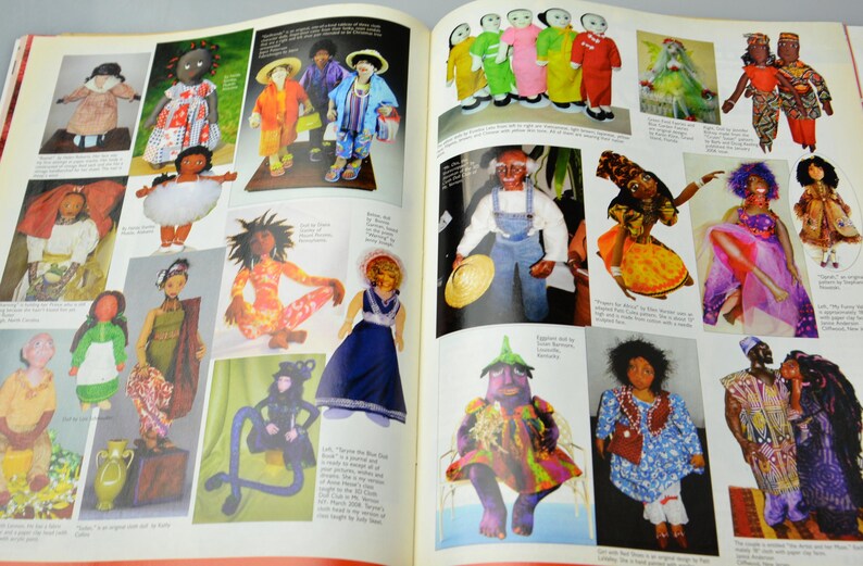 May include: A collection of handmade dolls in various styles and colors. The dolls are dressed in colorful clothing and have unique facial features. Some dolls are holding props, such as a hat or a flower. The dolls are displayed on a white background.