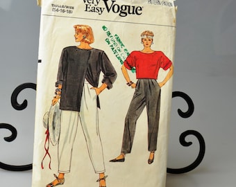 May include: Vintage Very Easy Vogue sewing pattern, size 14-16-18. The pattern features illustrations of two outfits: a black jacket with white pants and a red top with gray pants. The pattern includes the text "Fabric Kit" and "No Refund or Exchange on Patterns."