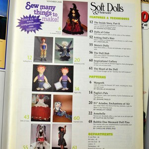 May include: A magazine cover for Soft Dolls & Animals! featuring a witch doll with a purple dress and a black hat. The magazine cover also features a variety of other dolls, including a mermaid doll, a fairy doll, and a witch doll. The magazine cover also includes the text "Sew many things to make!" and "Soft Dolls & Animals!"