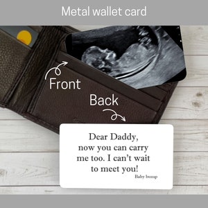 May include: A metal wallet card with a black and white ultrasound image on the front. The back of the card has the text "Dear Daddy, now you can carry me too. I can't wait to meet you! Baby bump."