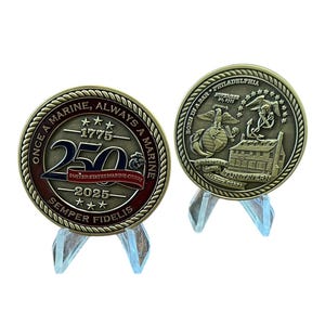 May include: Two bronze commemorative coins on clear stands. One coin features the text "ONCE A MARINE, ALWAYS A MARINE" and "250" with "1775-2025" and "SEMPER FIDELIS". The other coin has "BORN IN A BAR PHILADELPHIA" and "TUN TAVERN".