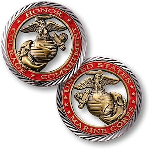 May include: Two round coins with the United States Marine Corps emblem. The emblem features an eagle, globe, and anchor in gold, surrounded by a red ring with the words "HONOR, COURAGE, COMMITMENT" and "UNITED STATES MARINE CORPS". The outer ring is silver and black.
