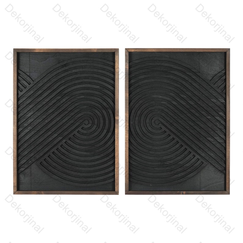 May include: Two black wood wall decor panels with a geometric pattern of concentric circles and lines. The panels are framed in dark wood.