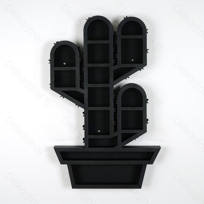 May include: Black wooden cactus-shaped wall shelf with multiple compartments. The shelf is designed to resemble a cactus in a pot, featuring arched compartments and spiky details. A decorative and functional piece for home decor.