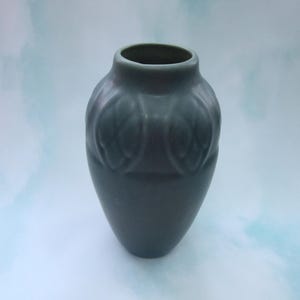 Rookwood Vase,# 2401, dated 1924, in a Dusty blue Color with impressed shapes .