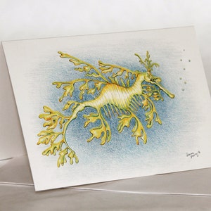 Seadragon - Grußkarte mit australischem Blattmotiv. Wasser; aqua, Seepferdchen, Fisch, Bläschen, gelb grün gold einzigartig australisches Tier