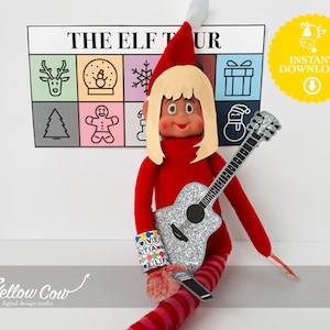 May include: A red elf doll with a blonde wig and a silver glitter guitar. The doll is wearing a red turtleneck and striped socks. A sign that says "THE ELF TOUR" is in the background, along with a yellow "INSTANT DOWNLOAD" sticker.