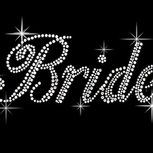 May include: The word "Bride" is spelled out in white rhinestones on a black background. The rhinestones are arranged in a cursive font, and there are starbursts around the word. This design is suitable for wedding-themed products.