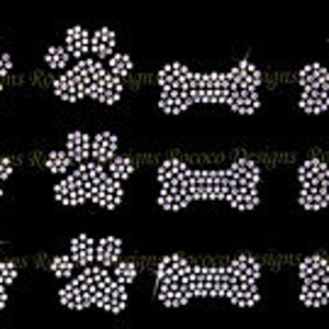 May include: A set of 12 iron-on rhinestone designs featuring paw prints and bone shapes. The designs are perfect for adding a touch of sparkle to clothing, bags, or other accessories.