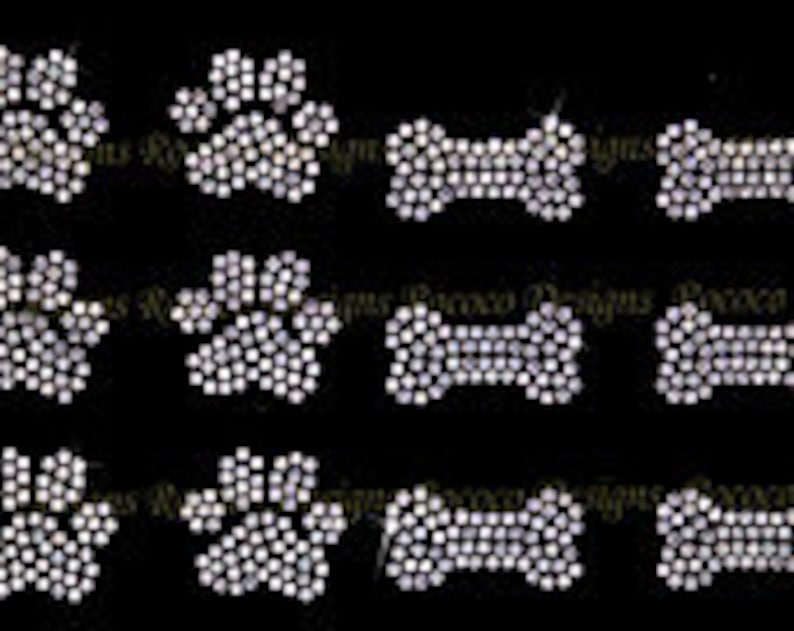 May include: A set of 12 iron-on rhinestone designs featuring paw prints and bone shapes. The designs are perfect for adding a touch of sparkle to clothing, bags, or other accessories.