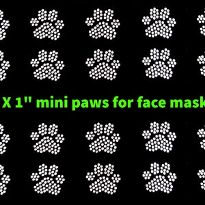 May include: Twenty-four white 1 inch mini paw print iron-on rhinestones for face masks. 1 X 1" mini paws for face mask.