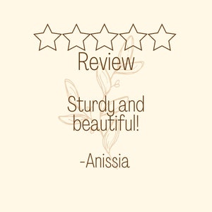 May include: Five star review with the text "Review", "Sturdy and beautiful!" and "-Anisssia".