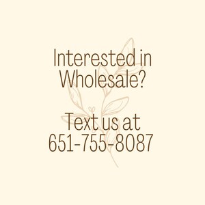 May include: Text graphic with a floral design. Interested in Wholesale? Text us at 651-755-8087.
