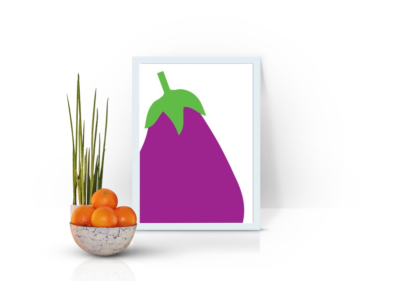 May include: A white framed print with a purple eggplant illustration on a white background. The eggplant has a green stem and leaves.