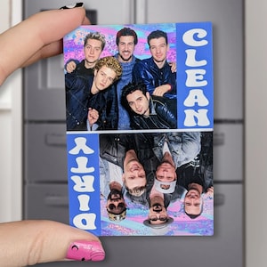 May include: A blue and white magnet with a photo of a band on it. The top half of the magnet says "CLEAN" and the bottom half says "DIRTY".
