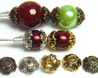 May include: Assortment of decorative bead caps in gold, silver, and bronze finishes. The caps feature intricate floral designs and are perfect for adding a touch of elegance to jewellery projects.