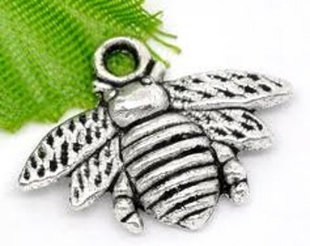 May include: Silver-toned bee charm with detailed wings and a textured body. The charm has a loop at the top for attaching to jewelry or other crafts.