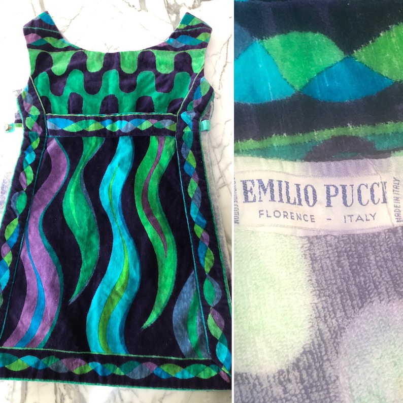 May include: A sleeveless, short, vintage dress with a geometric pattern in shades of green, blue, purple, and black. The dress has a label that reads "Emilio Pucci Florence - Italy".