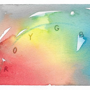 May include: A watercolor painting of a rainbow color wheel with the letters R, O, Y, G, B, I, and V written on it.