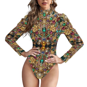 May include: A long-sleeved bodysuit with a high neck and a jewel-toned print. The print features gold, green, red, and blue jewels and ornate gold designs.