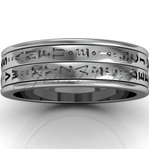 May include: A silver band with three rows of engraved text. The text is in a stylised font and appears to be a language other than English.