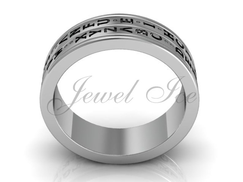 May include: A silver band ring with a black inscription around the entire band. The inscription reads "I CHOOSE YOU" in a stylised font.