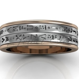 May include: A silver and rose gold band with three rows of engraved Hebrew text.