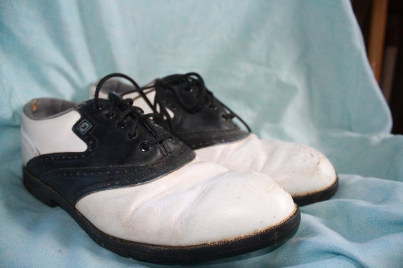 black and white golf shoes