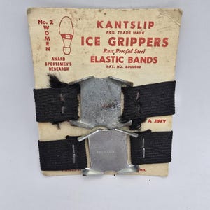 May include: Vintage Kantslip ice grippers for women, featuring rust-proof steel and elastic bands. The packaging includes the text "No. 2 WOMEN" and "ICE GRIPPERS". The product is designed for use on ice.