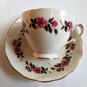 Royal Vale Bone China Tea Cup and Saucer - Rodney Potterer Ltd. English Collectible Tea Set - Pink Roses on White Porcelain - Repaired