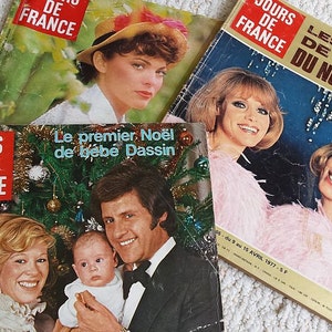 May include: Three vintage copies of the French magazine "Jours de France". The covers feature a woman in a hat, a woman in a pink feathered boa, and a family with a baby.