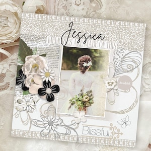 Può includere: Una pagina di scrapbook a tema matrimonio con una foto di una sposa con un bouquet. La pagina è decorata con abbellimenti floreali, il nome "Jessica" e la parola "Blissful". È presente anche la frase "MEMORIES ARE MADE OF THIS".